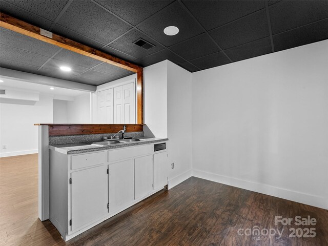 100 Tarragon Pl, Flat Rock, NC 28731 - kitchen featuring a sink, dark wood finished floors, baseboards, recessed lighting, and white cabinetry