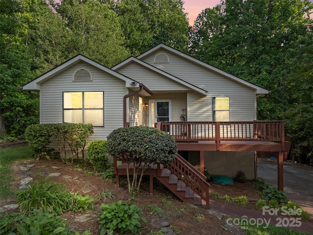 100 Tarragon Pl, Flat Rock, NC 28731 - view of front of house featuring a wooden deck and stairway