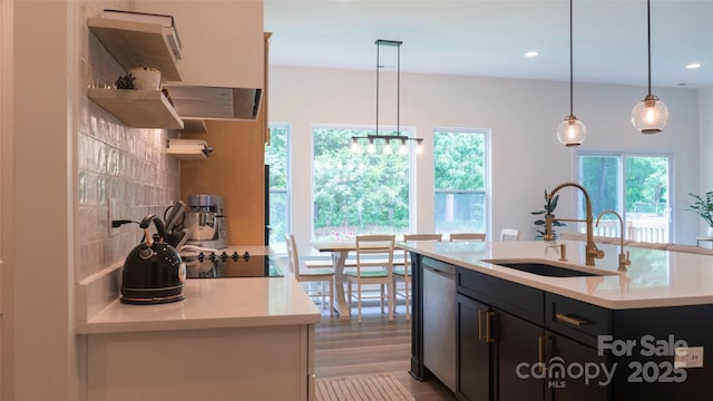 4710 Old Pageland Marshville Rd, Monroe, NC 28112 - kitchen with open shelves, a sink, stainless steel dishwasher, light countertops, and black electric cooktop