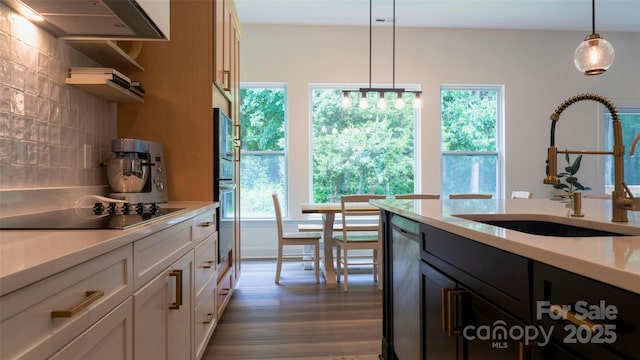 4710 Old Pageland Marshville Rd, Monroe, NC 28112 - kitchen featuring a sink, black electric stovetop, light countertops, tasteful backsplash, and dark wood-style floors