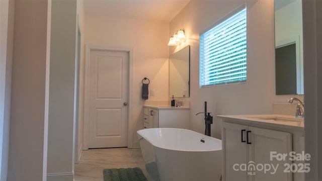 4710 Old Pageland Marshville Rd, Monroe, NC 28112 - full bath with marble look tile flooring, a freestanding tub, and two vanities