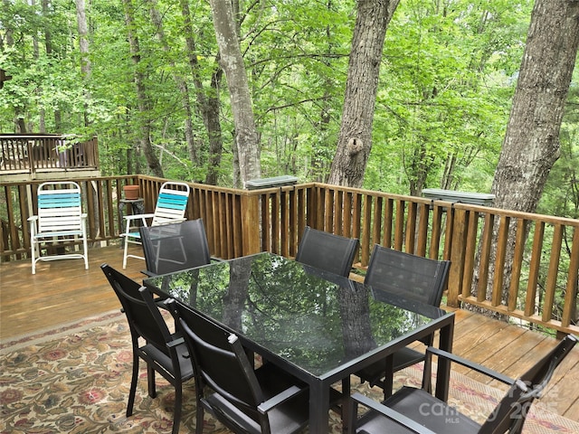 105 Bent Creek Blvd Unit 16, Lake Lure, NC 28746 - wooden deck featuring outdoor dining area and a forest view