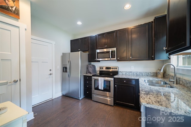 624 Cardwell Ln, Fletcher, NC 28732 - kitchen featuring appliances with stainless steel finishes, a sink, dark wood-type flooring, recessed lighting, and light stone countertops
