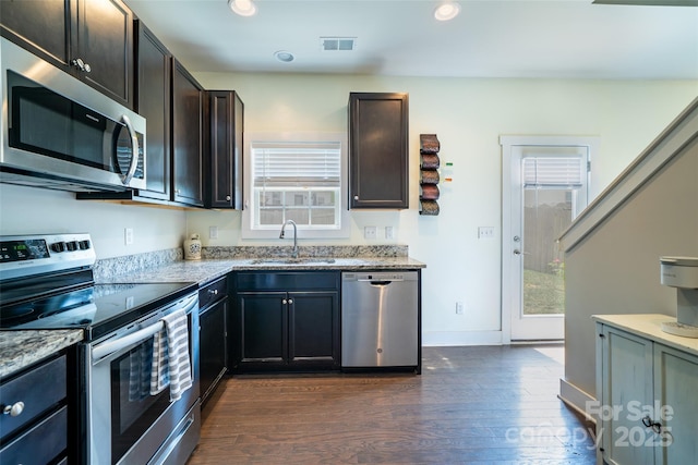 624 Cardwell Ln, Fletcher, NC 28732 - kitchen with appliances with stainless steel finishes, a sink, light stone countertops, dark wood-style floors, and recessed lighting