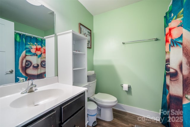 624 Cardwell Ln, Fletcher, NC 28732 - full bath featuring vanity, wood finished floors, toilet, and baseboards