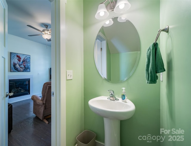 624 Cardwell Ln, Fletcher, NC 28732 - bathroom featuring a glass covered fireplace, a ceiling fan, and wood finished floors