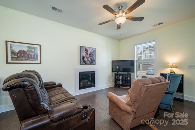 624 Cardwell Ln, Fletcher, NC 28732 - living area featuring baseboards, ceiling fan, dark wood-type flooring, and a glass covered fireplace