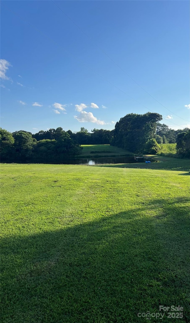 714 Helms Efird Rd, Marshville, NC 28103 - view of community featuring a water view and a lawn
