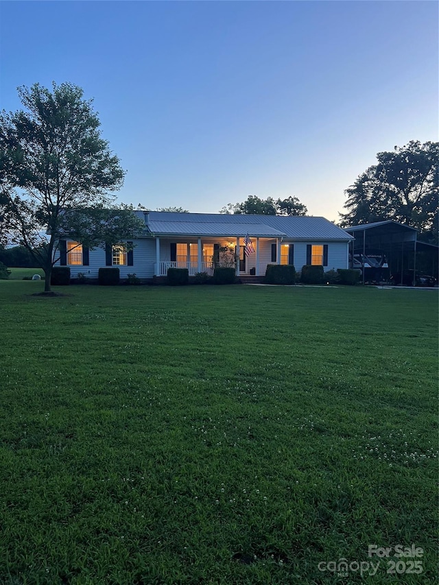 714 Helms Efird Rd, Marshville, NC 28103 - back of property at dusk featuring a yard and a metal roof