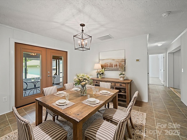 714 Helms Efird Rd, Marshville, NC 28103 - dining area with a chandelier, tile patterned floors, french doors, and a textured ceiling