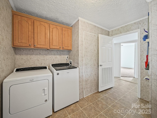 714 Helms Efird Rd, Marshville, NC 28103 - washroom with cabinet space, ornamental molding, washer and clothes dryer, light tile patterned floors, and a textured ceiling