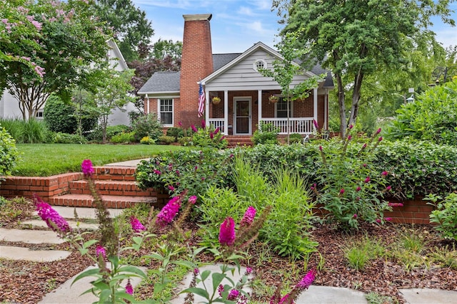 1729 Kensington Dr, Charlotte, NC 28205 - view of front of property featuring covered porch, a chimney, brick siding, and a front yard