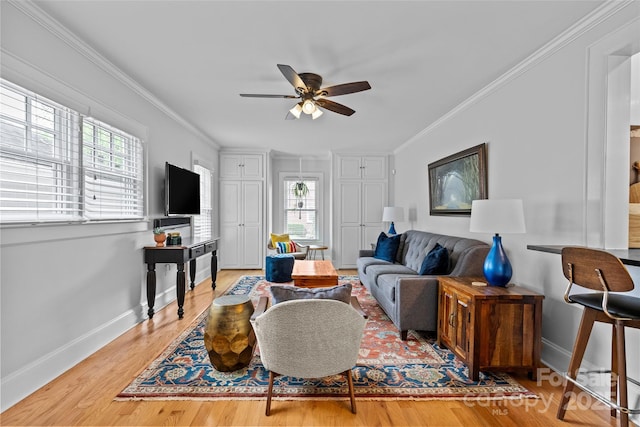 1729 Kensington Dr, Charlotte, NC 28205 - living area featuring a ceiling fan, healthy amount of natural light, baseboards, and crown molding