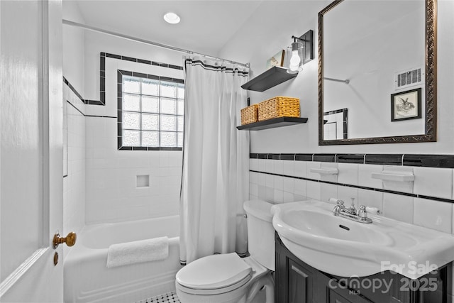 1729 Kensington Dr, Charlotte, NC 28205 - full bath with vanity, toilet, shower / bathtub combination with curtain, tile walls, and wainscoting