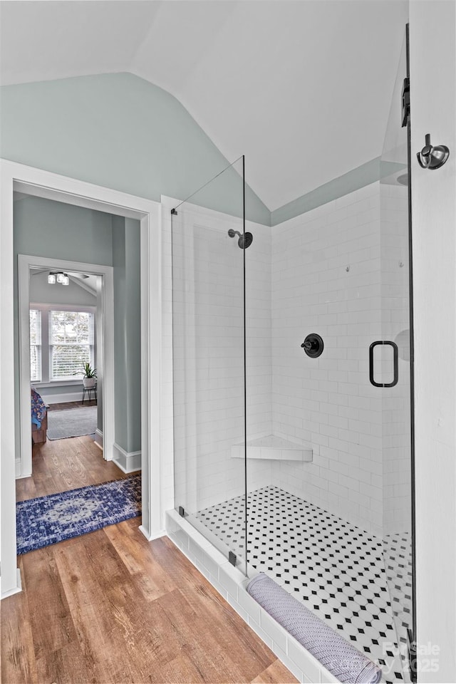 1729 Kensington Dr, Charlotte, NC 28205 - bathroom featuring lofted ceiling, a shower stall, wood finished floors, and ceiling fan