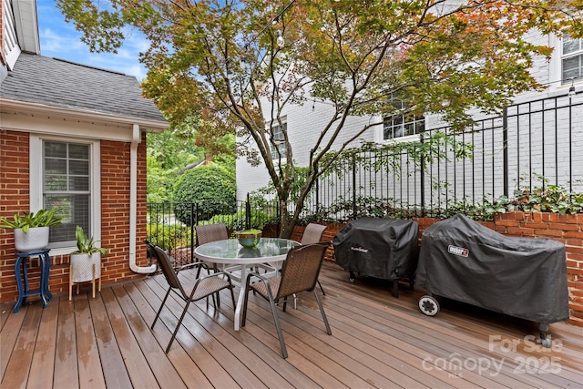 1729 Kensington Dr, Charlotte, NC 28205 - wooden terrace with outdoor dining area and grilling area