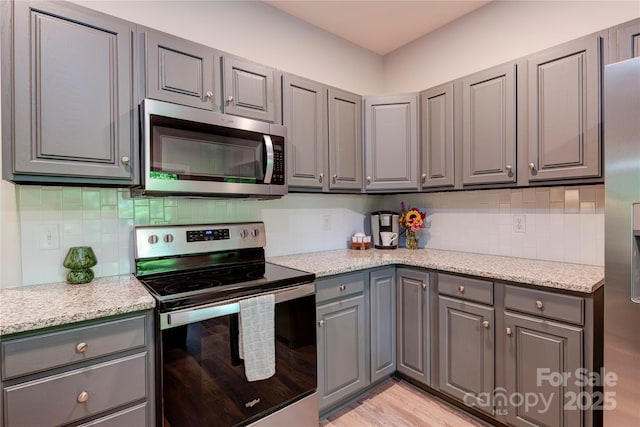 145 Inn At Crestwood Dr, Boone, NC 28607 - kitchen featuring stainless steel appliances, gray cabinets, and backsplash
