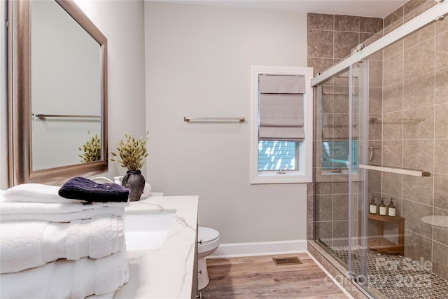 145 Inn At Crestwood Dr, Boone, NC 28607 - bathroom featuring vanity, toilet, a stall shower, wood finished floors, and baseboards