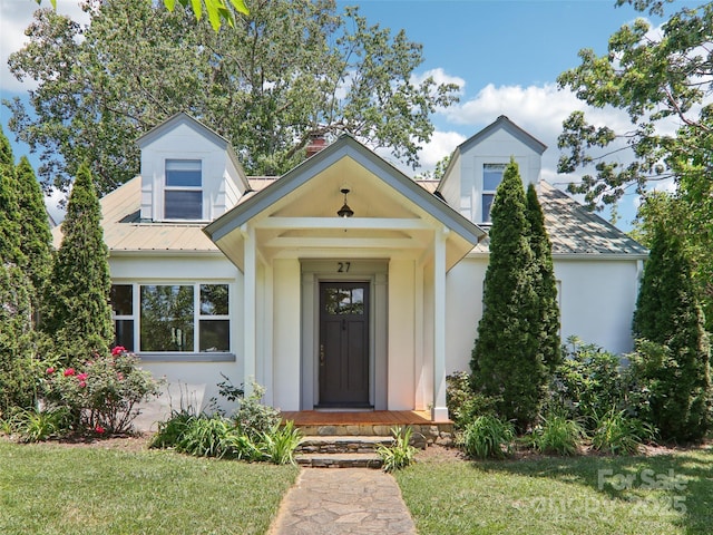 27 Alabama Ave, Weaverville, NC 28787 - view of front of home featuring a front lawn, stucco siding, and a chimney
