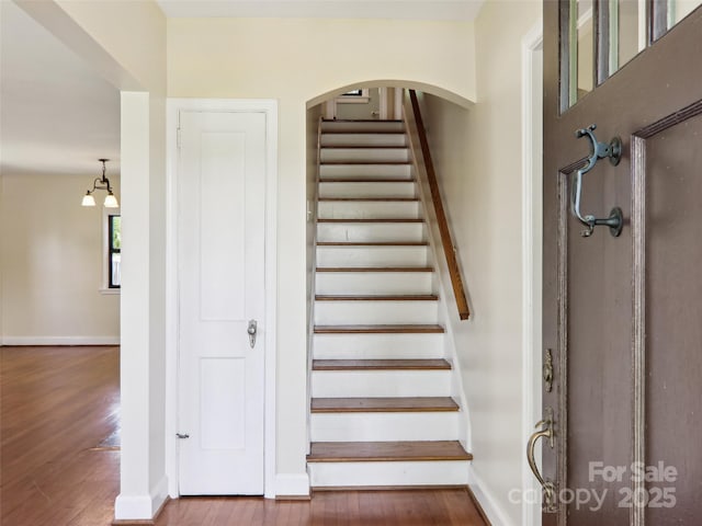 27 Alabama Ave, Weaverville, NC 28787 - stairs featuring hardwood / wood-style flooring, baseboards, and a chandelier