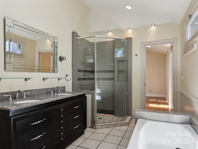 27 Alabama Ave, Weaverville, NC 28787 - bathroom featuring a stall shower, double vanity, lofted ceiling, a garden tub, and tile patterned flooring