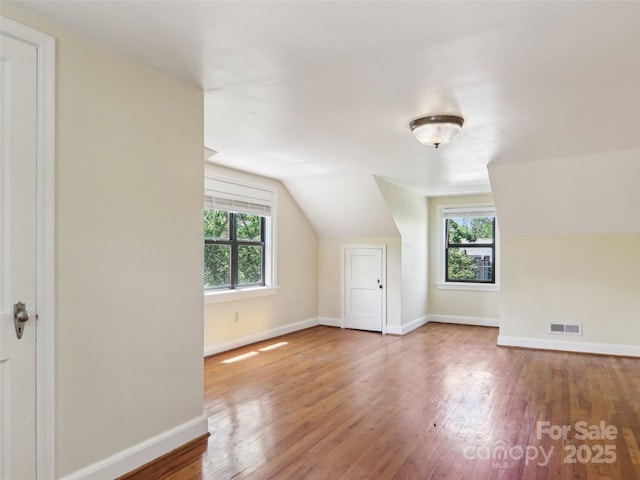 27 Alabama Ave, Weaverville, NC 28787 - additional living space featuring hardwood / wood-style floors, lofted ceiling, and baseboards
