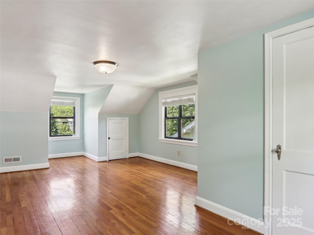 27 Alabama Ave, Weaverville, NC 28787 - additional living space featuring lofted ceiling, plenty of natural light, hardwood / wood-style flooring, and baseboards