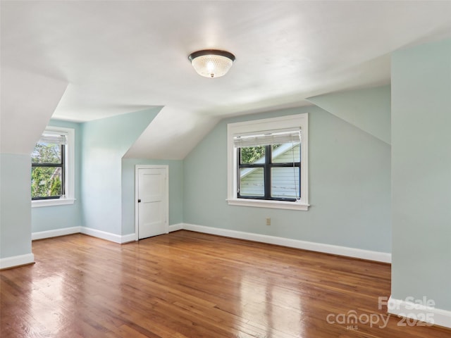 27 Alabama Ave, Weaverville, NC 28787 - bonus room with vaulted ceiling, plenty of natural light, wood finished floors, and baseboards