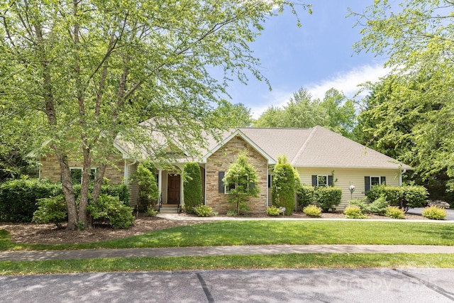 190 Jonathan Creek Dr, Etowah, NC 28729 - view of front facade featuring stone siding and a front yard