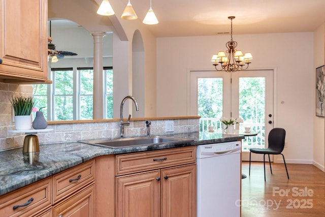 190 Jonathan Creek Dr, Etowah, NC 28729 - kitchen with dishwasher, a sink, arched walkways, backsplash, and a chandelier