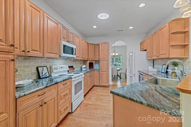 190 Jonathan Creek Dr, Etowah, NC 28729 - kitchen with white appliances, a sink, open shelves, arched walkways, and light wood-style flooring