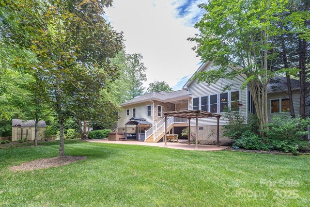 190 Jonathan Creek Dr, Etowah, NC 28729 - rear view of house with a patio area, a pergola, a yard, and a deck