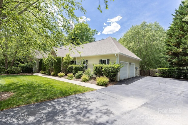 190 Jonathan Creek Dr, Etowah, NC 28729 - view of side of home featuring driveway, a garage, and roof with shingles