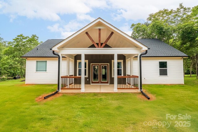 1246 Bob Falls Rd, Shelby, NC 28150 - back of property with a lawn, covered porch, and roof with shingles