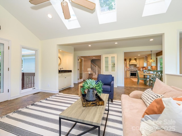 7356 Terrace Dr, Charlotte, NC 28211 - living room featuring a skylight, recessed lighting, vaulted ceiling, plenty of natural light, and stairway