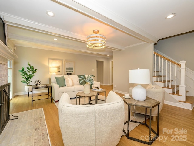 7356 Terrace Dr, Charlotte, NC 28211 - living room featuring crown molding, stairs, wood finished floors, baseboards, and a fireplace