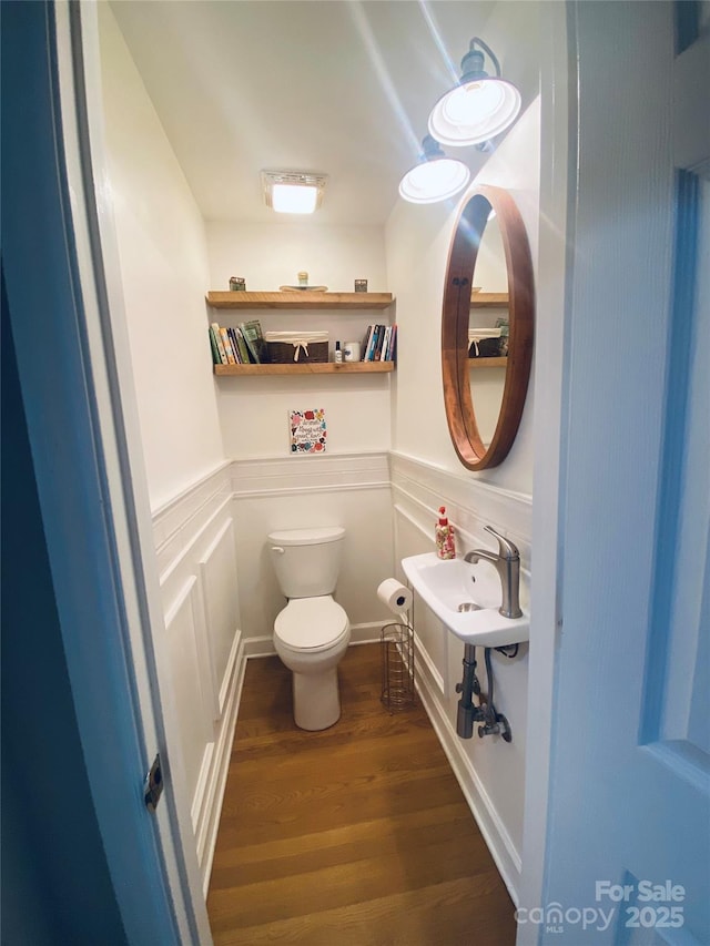 7356 Terrace Dr, Charlotte, NC 28211 - half bathroom featuring toilet, wood finished floors, and wainscoting