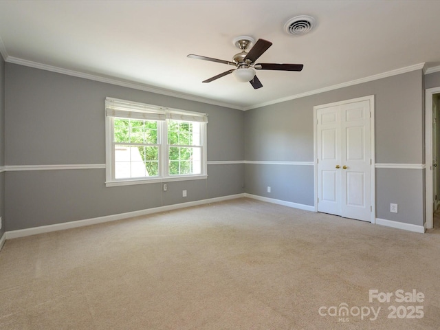 7356 Terrace Dr, Charlotte, NC 28211 - unfurnished bedroom featuring crown molding, baseboards, carpet floors, a closet, and a ceiling fan