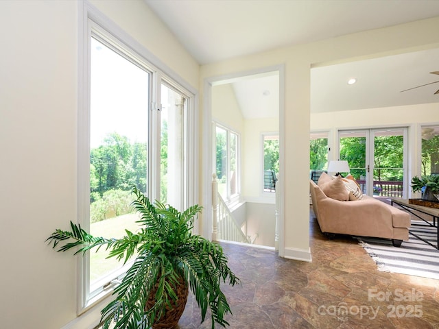 7356 Terrace Dr, Charlotte, NC 28211 - living area featuring stone finish floors, ceiling fan, and baseboards
