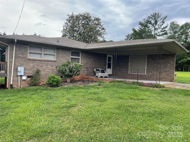 114 Aqua Dr, Forest City, NC 28043 - ranch-style house featuring a front yard and brick siding
