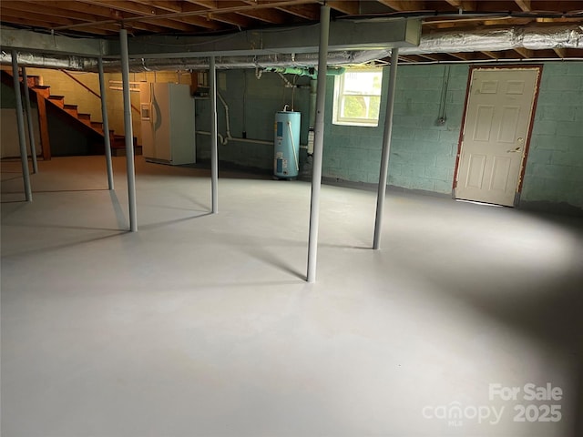 114 Aqua Dr, Forest City, NC 28043 - basement with water heater, white refrigerator with ice dispenser, and stairs