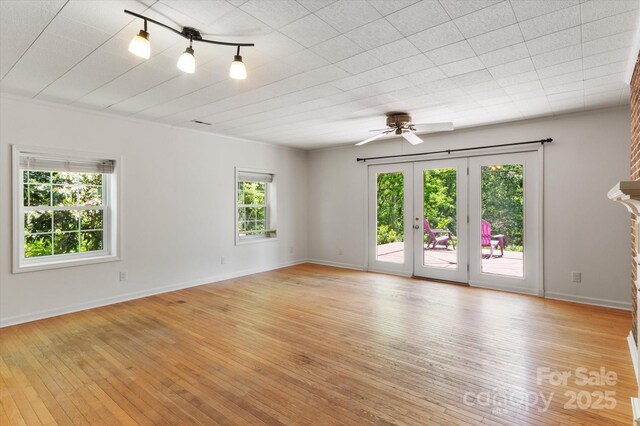 103 Hampshire Ln, Canton, NC 28716 - unfurnished room with light wood-type flooring, ceiling fan, and baseboards