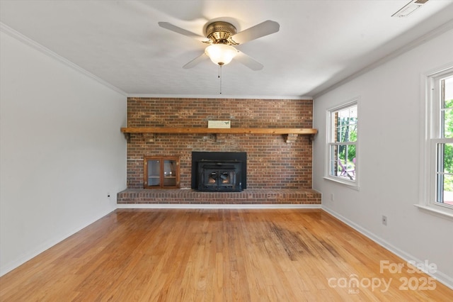 103 Hampshire Ln, Canton, NC 28716 - unfurnished living room featuring light wood finished floors, plenty of natural light, ceiling fan, and ornamental molding