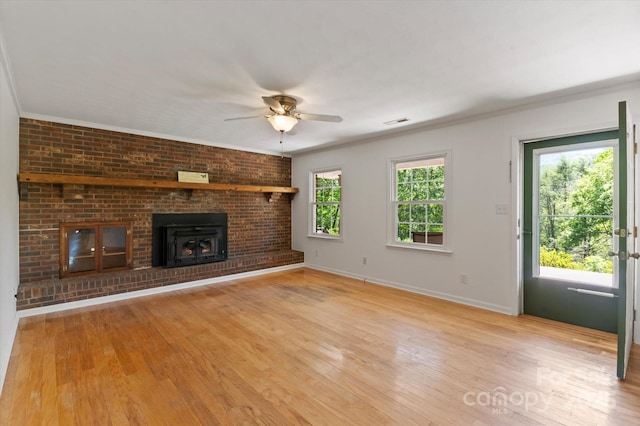 103 Hampshire Ln, Canton, NC 28716 - unfurnished living room featuring a ceiling fan, light wood finished floors, ornamental molding, and baseboards