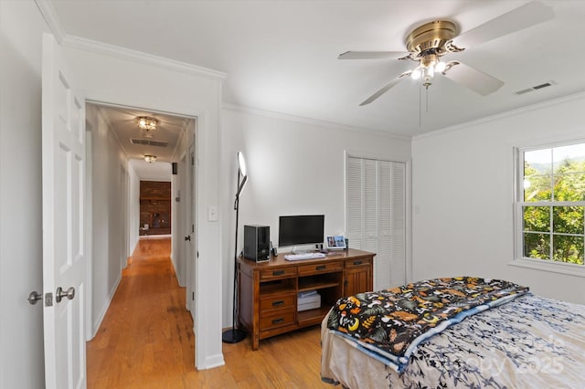 103 Hampshire Ln, Canton, NC 28716 - bedroom featuring attic access, light wood-style flooring, a closet, crown molding, and ceiling fan