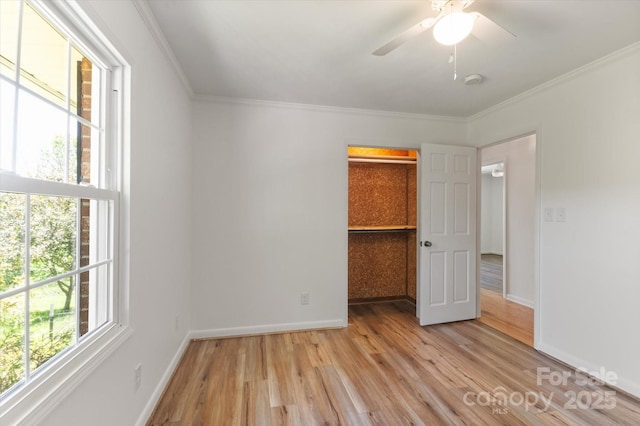 103 Hampshire Ln, Canton, NC 28716 - unfurnished bedroom featuring light wood-type flooring, ornamental molding, baseboards, and a closet