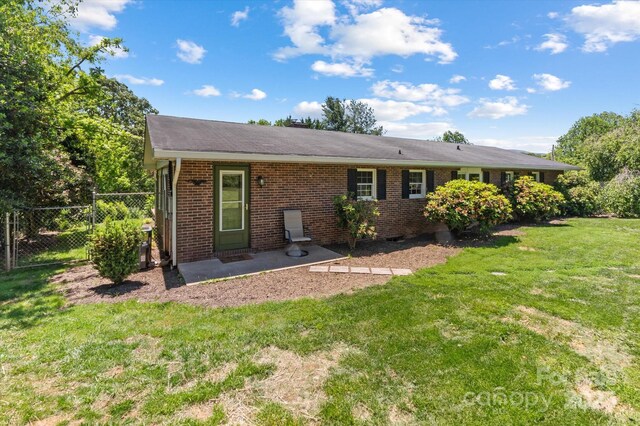 103 Hampshire Ln, Canton, NC 28716 - back of property with brick siding, a patio, and crawl space