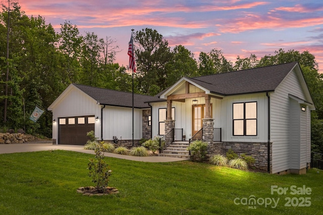 2577 Bonnybrook Cir, Rock Hill, SC 29732 - modern farmhouse featuring stone siding, concrete driveway, a garage, a lawn, and a shingled roof