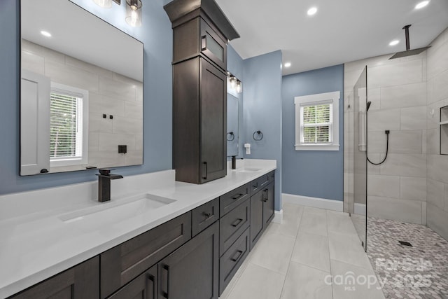 2577 Bonnybrook Cir, Rock Hill, SC 29732 - bathroom with double vanity, a tile shower, tile patterned flooring, recessed lighting, and baseboards
