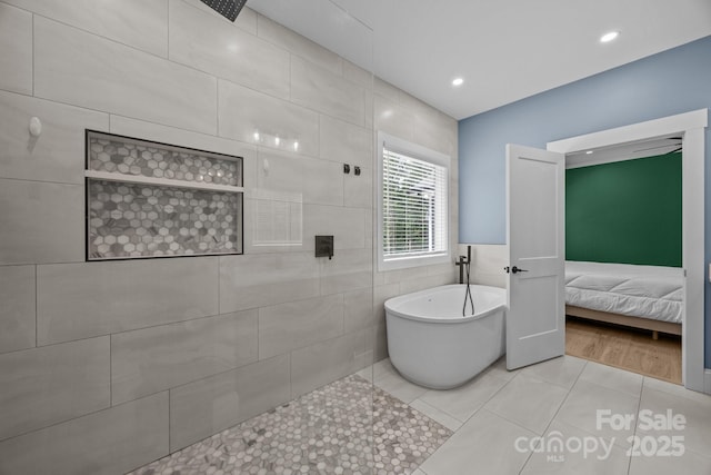2577 Bonnybrook Cir, Rock Hill, SC 29732 - bathroom featuring tile walls, a freestanding bath, tile patterned floors, recessed lighting, and connected bathroom